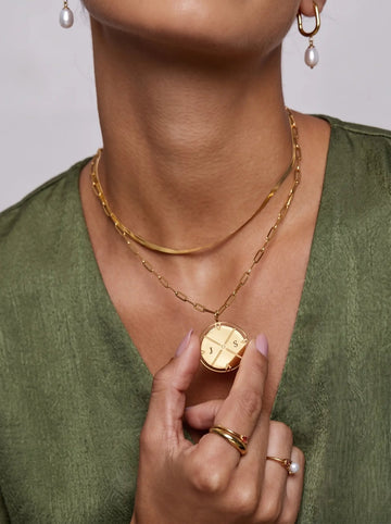 Engraved Initial North Necklace worn by a customer