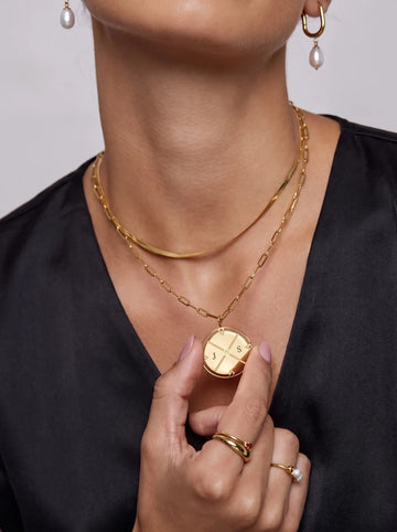 Engraved Initial North Necklace worn by a customer